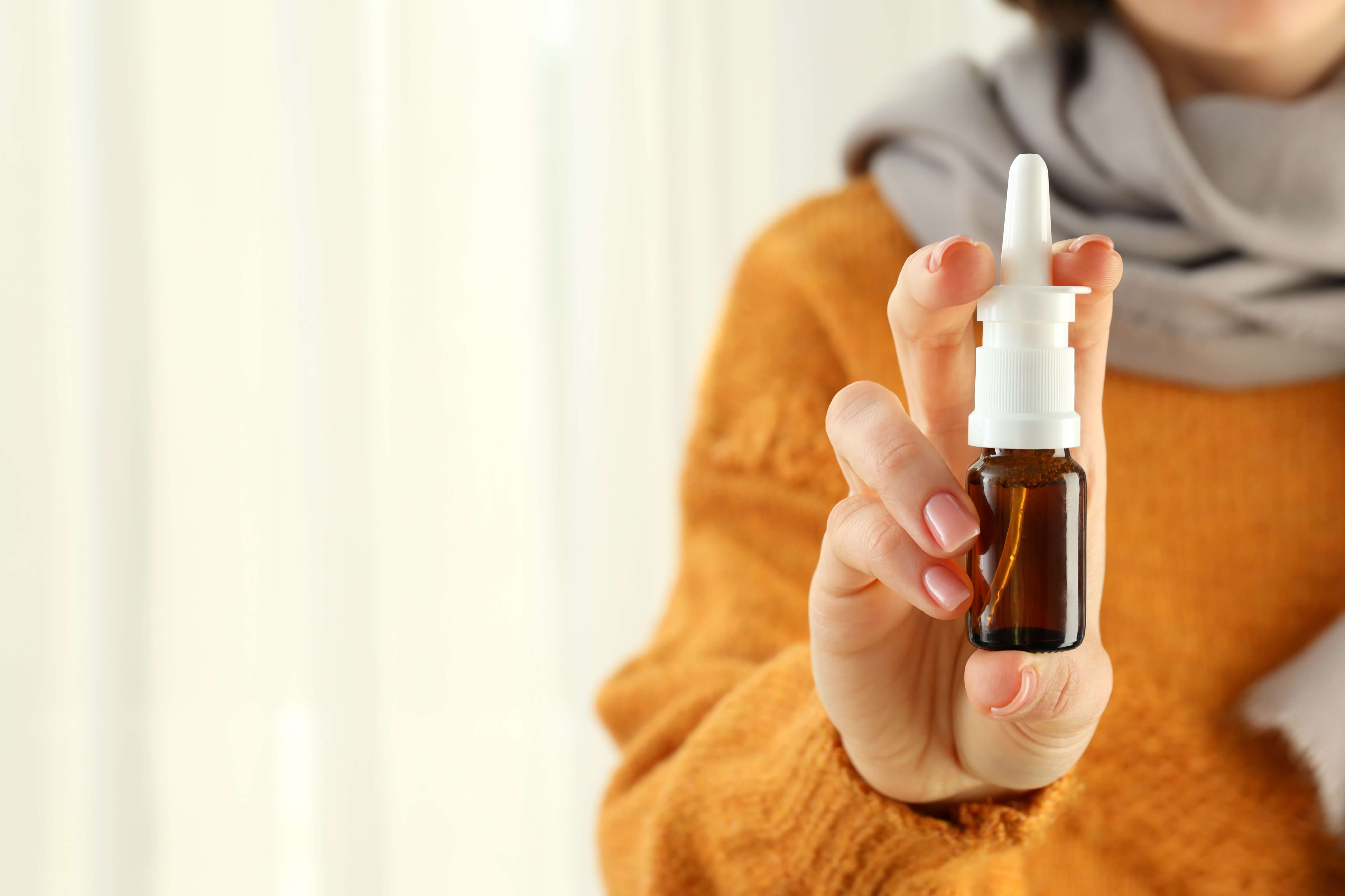 Woman Holds Nasal Spray